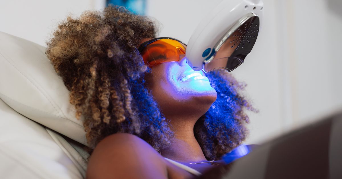 woman receiving teeth whitening service